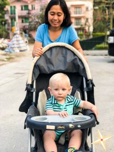 meet our domestic helper Theresa- helper pushing baby in stroller
