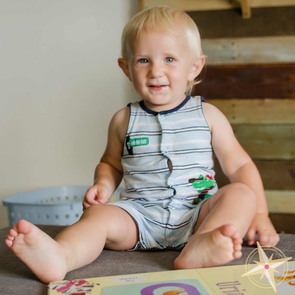 Toddler reading Peekaboo A to Z