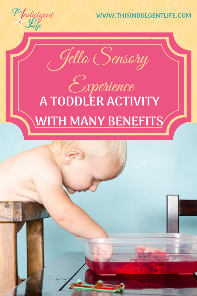 Jello Sensory Experience- A toddler Activity With Many Benefits | This Indulgent Life | This simple and cheap activity has many benefits for your toddler's development. There are also many extension activities and books that will make this activity a complete experience. | #jello #sensoryplay #sensorybins #sensoryactivitiestoddlers #toddleractivities #toddlerplay #toddlerlearning #sensorytoddlers #benefitsofsensoryplay #toddlerdevelopment