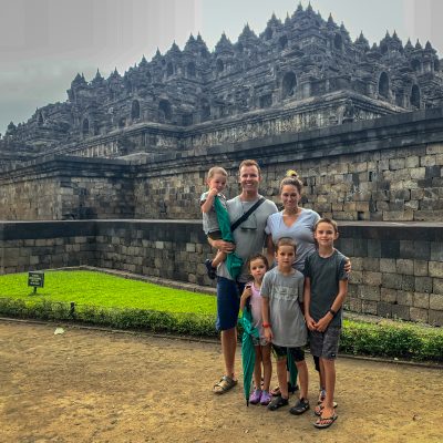 our squad abroad around the world adventure with a large family in front of a temple