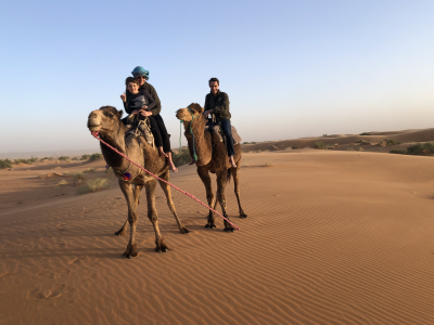 Kirsty and her family on a camel- Luxury family travel in africa